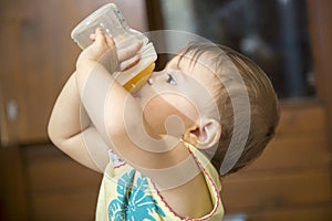 Baby drinking water from bottle