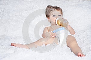 Baby drinks from bottle
