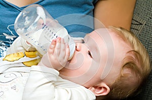 Baby eating from bottle