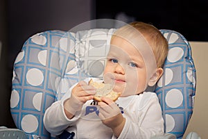 Baby eating bread