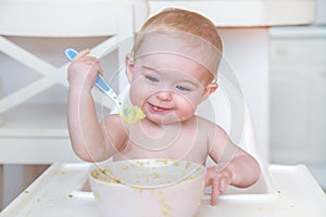 baby eating first solid food