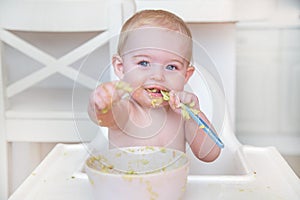 Baby eating first solid food