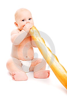 Baby eating French bread