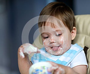Baby eating yogurt