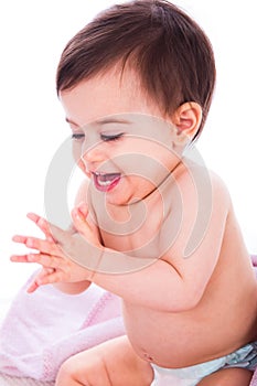 Baby enjoying by clapping hands