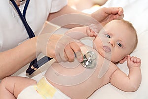 Baby examination with stethoscope