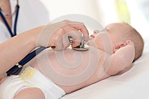 Baby examination with stethoscope