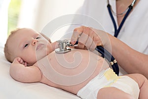 Baby examination with stethoscope