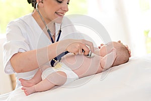 Baby examination with stethoscope