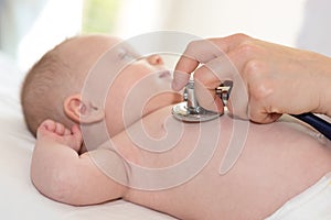 Baby examination with stethoscope