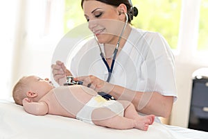 Baby examination with stethoscope