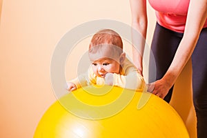 Baby exercises on fitball