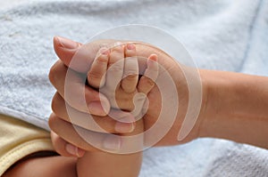 Baby and father's hands