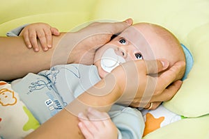 Baby with father's hands