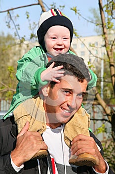 Baby on father's shoulders