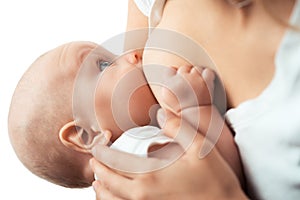 Baby feeds on MOM's breasts