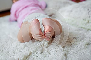 Baby feet - baby`s legs, feet of a newborn baby