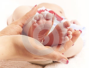 Baby feet in hands