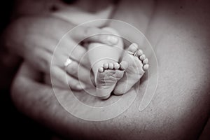 Baby feet. Happy Family concept. Beautiful conceptual image of Maternity