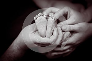 Baby feet. Happy Family concept. Beautiful conceptual image of Maternity