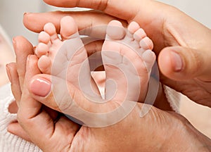 Baby feet in mom's hands