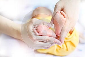 Baby feet in mother hands