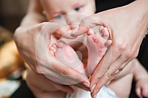 Baby feet in mother hands