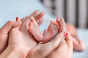 Baby feet in mother hands