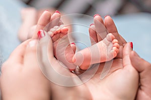 Baby feet in mother hands