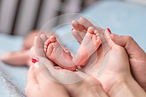 Baby feet in mother hands