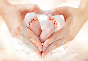 Baby feet in mother hands