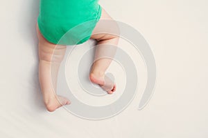 Baby feet on white background