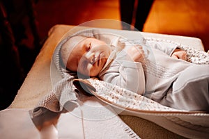 A baby fell asleep on a dressing table in a Church. the ordinance of baptism.