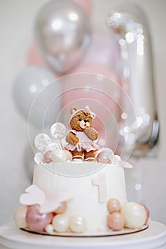 Baby First Birthday Cake with a Bear figurine