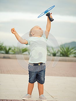 Baby with flying saucer