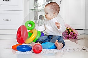 The baby is fond of toys at home. The concept of childhood devel