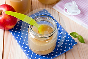 Baby food in bank and on a table