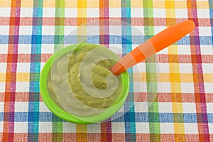 Baby food on a colorful place mat