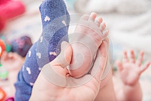 baby foot. Close up of mixed race newborn baby girl& x27;s feet