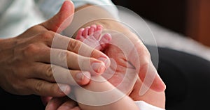 baby foot massage. Baby feet in mother s hands. Childcare happy childhood