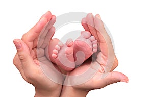 Baby foot in mother hands on white background