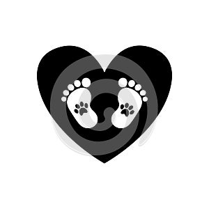 Baby footprints with pet pawprints inside of black heart photo