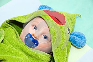 Baby in frog towel