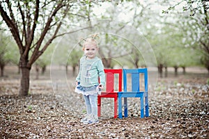 Baby girl and almond blossom