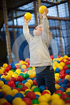 Baby girl in ball pool