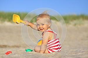 Baby girl on a beach photo