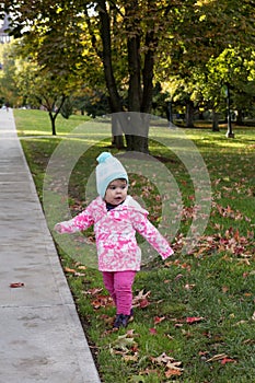 Baby Girl in Beautiful Park in Autumn