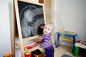 Baby girl and blackboard