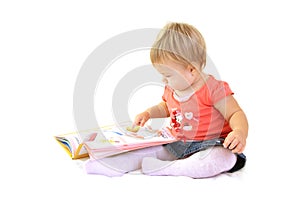 Baby girl with book