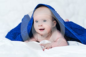 Baby girl or boy after shower with towel on head